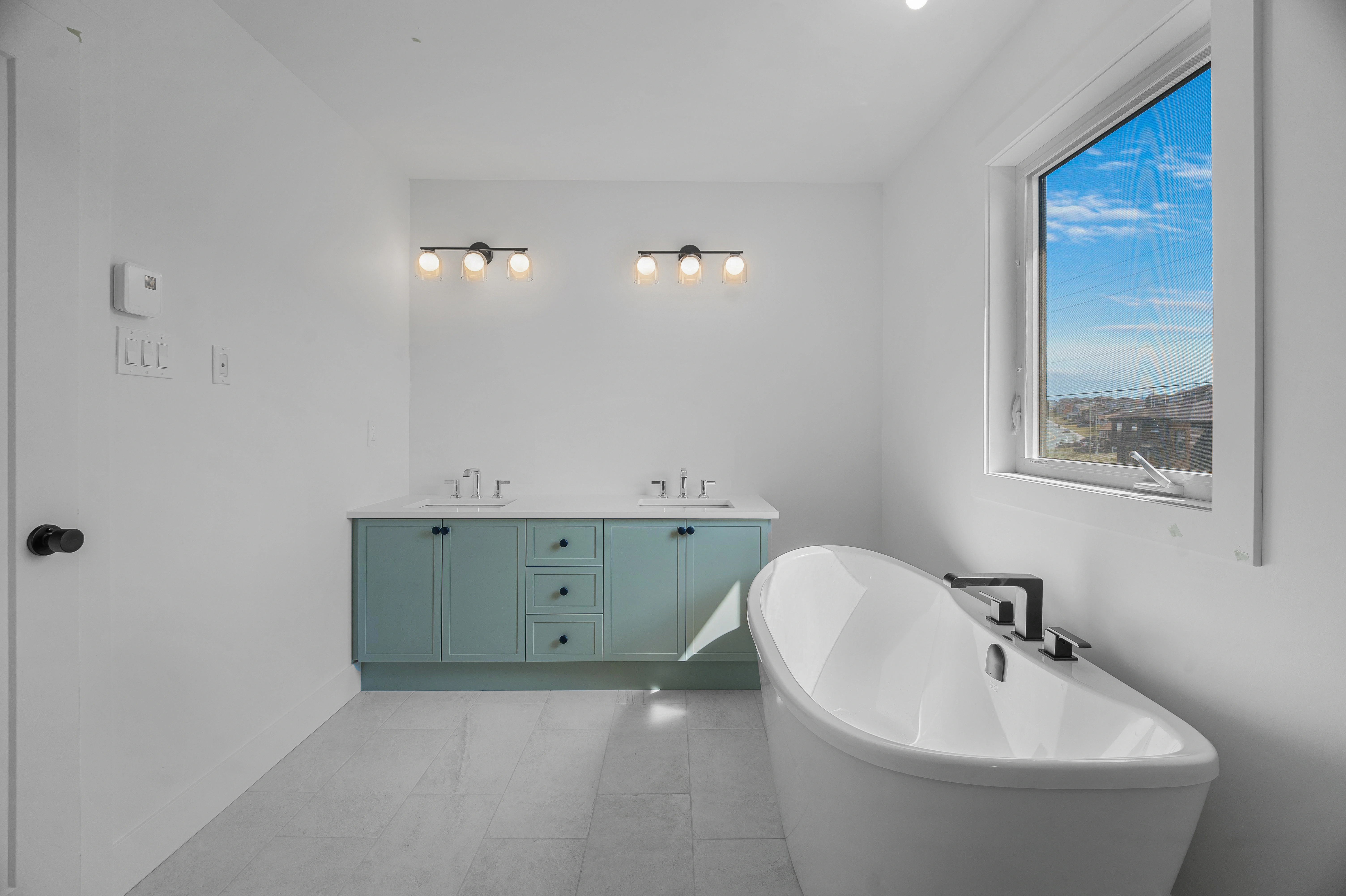 Saltwater House — Ensuite with freestanding bathtub