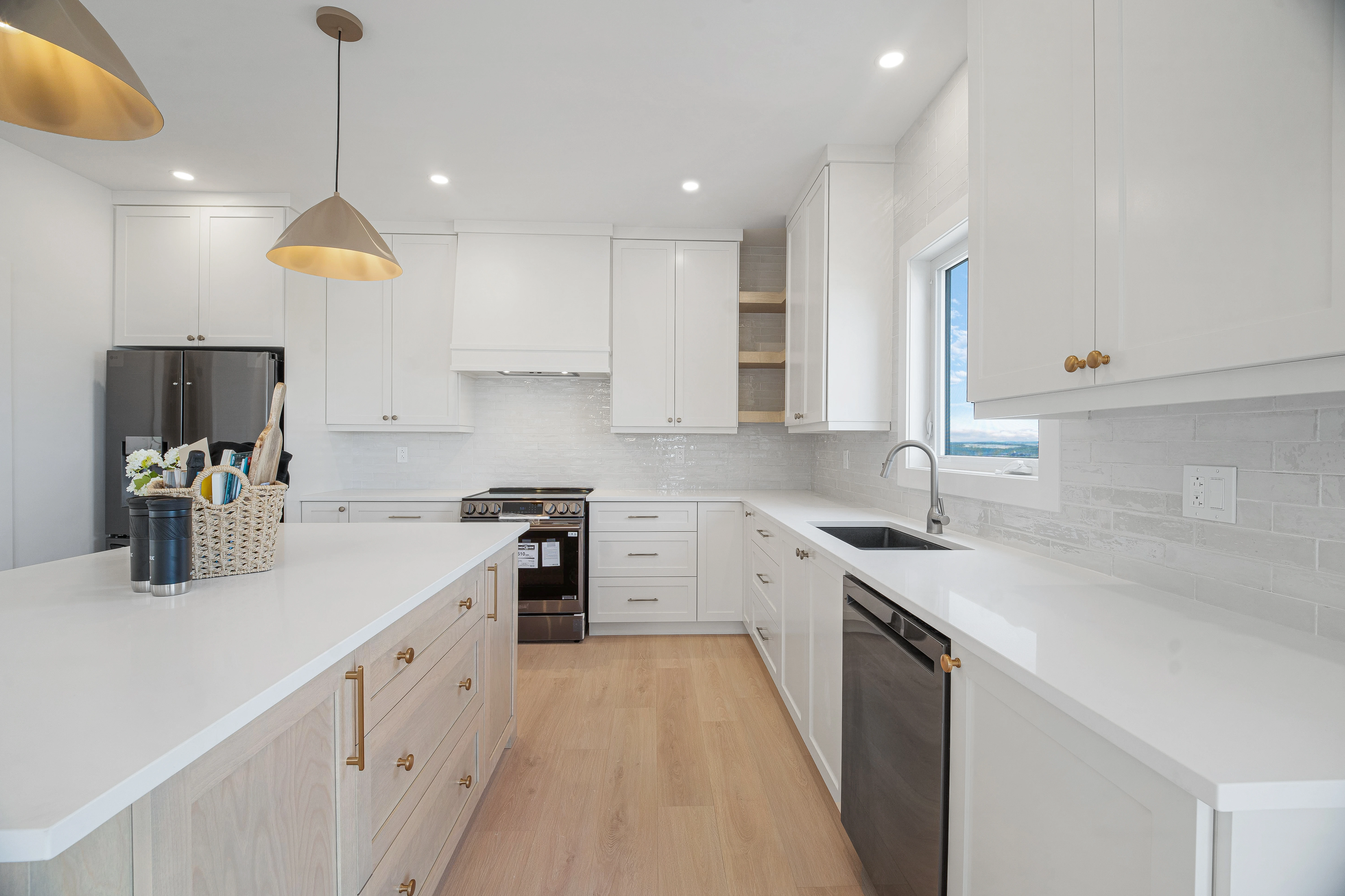 Saltwater House — White kitchen cabinetry and island