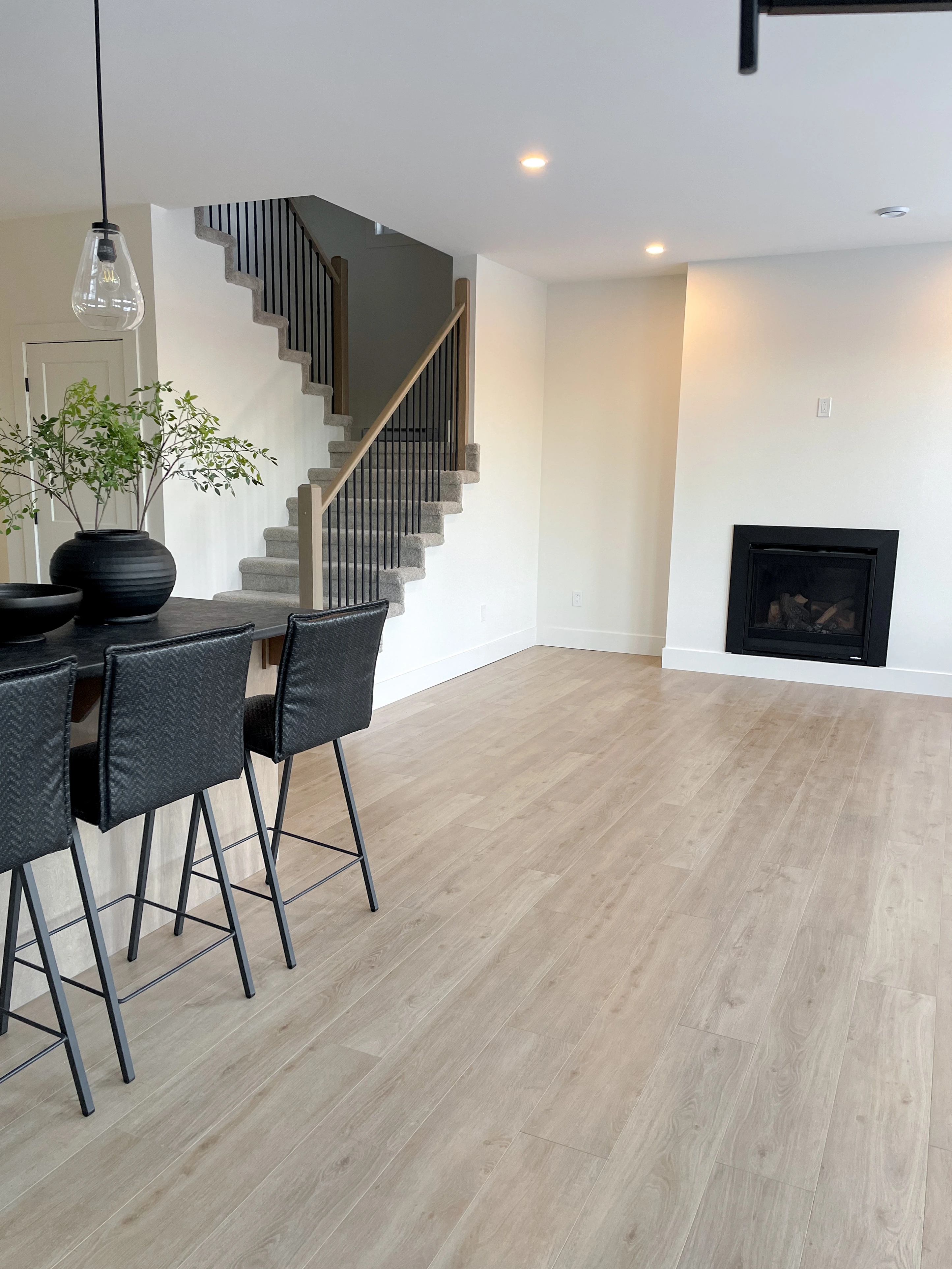 The Pitcher Plant — Living room fireplace beside the staircase