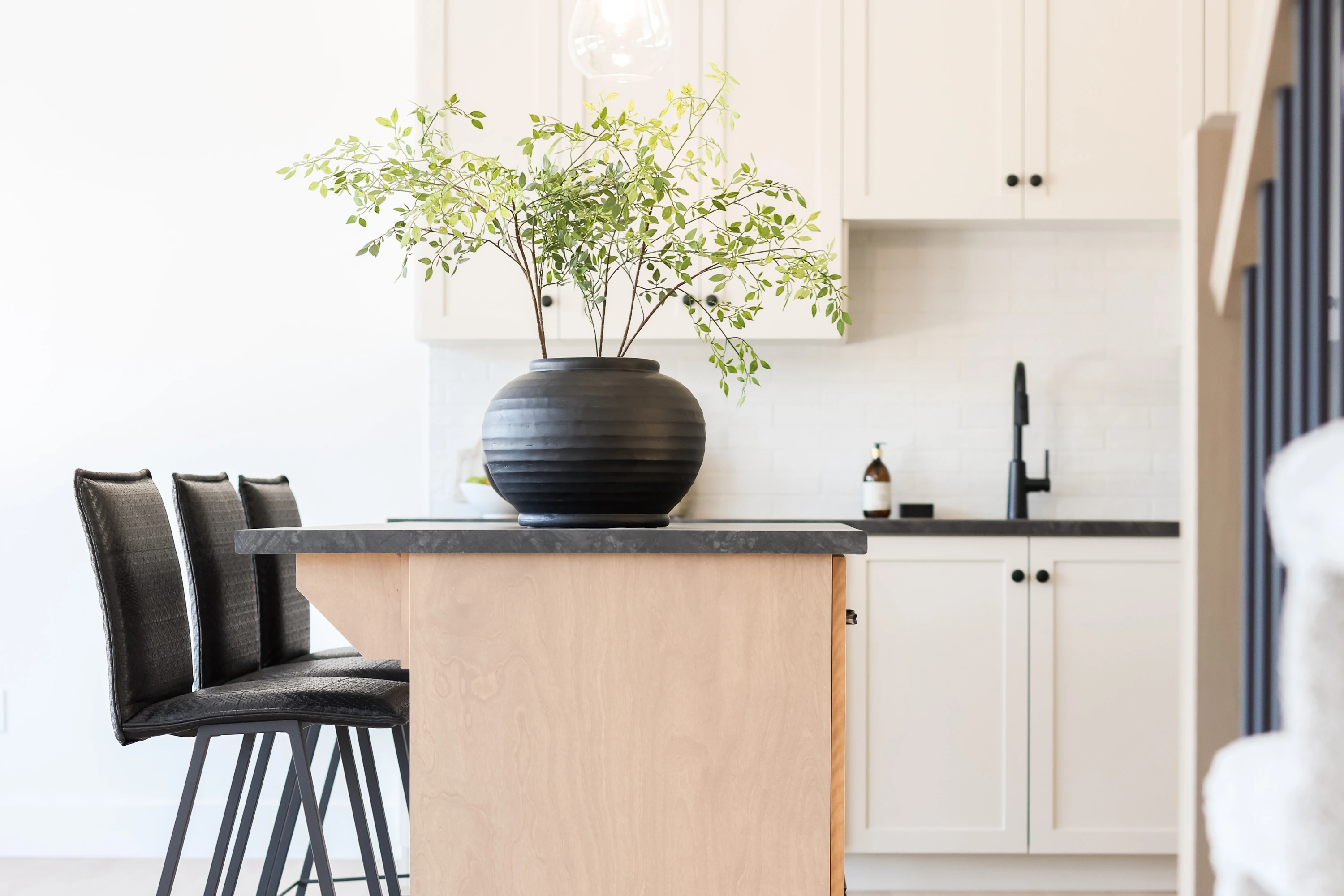 The Pitcher Plant — Island seating and oak cabinetry