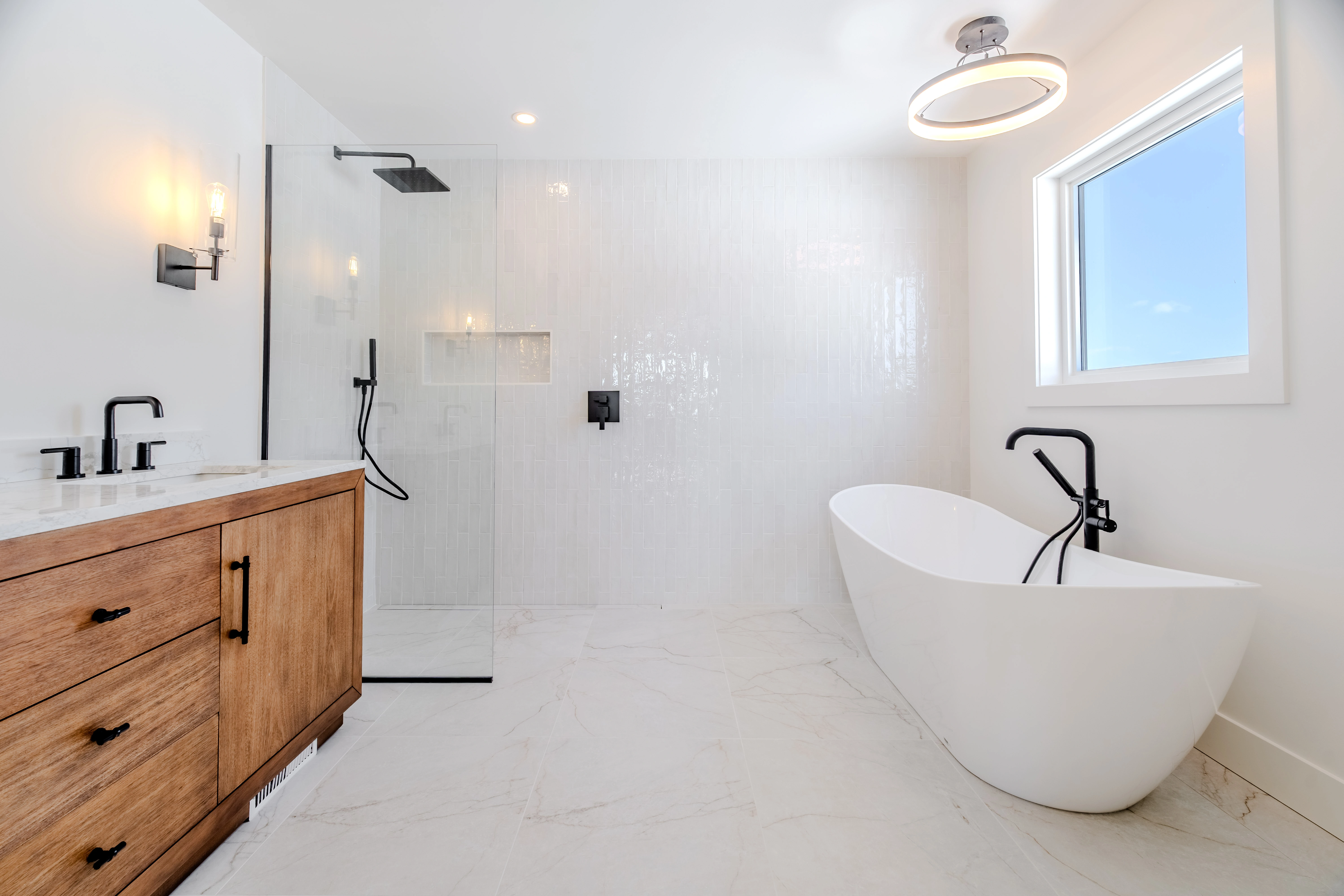 The Tuckamore — Ensuite with oak vanity and bathtub